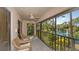 Relaxing screened balcony overlooking a pond and lush landscape at 7610 Fairway Woods Dr # 205, Sarasota, FL 34238