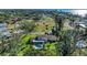 Stunning aerial view of property with pool, lush greenery and close proximity to the ocean at 7820 Seville Cir, Bradenton, FL 34209