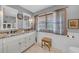 Elegant bathroom with a double vanity, natural light, and neutral color palette at 7820 Seville Cir, Bradenton, FL 34209