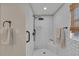 Bathroom with a glass-enclosed shower, white subway tile, and black hardware at 7820 Seville Cir, Bradenton, FL 34209