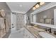 Bathroom featuring a double sink with granite countertops, tiled floors and gray paint at 7820 Seville Cir, Bradenton, FL 34209