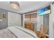 Bedroom featuring hardwood floors, a TV, and neutral gray paint at 7820 Seville Cir, Bradenton, FL 34209