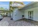 Exterior patio with brick floors and view of the outdoor dining area at 7820 Seville Cir, Bradenton, FL 34209