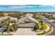 Aerial view of home with two-car garage and manicured landscaping at 9367 Hawk Nest Ln, North Port, FL 34287