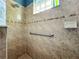 Walk-in shower with grab bar and tile surround at 9367 Hawk Nest Ln, North Port, FL 34287