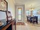 Bright dining room with a charming chandelier and hardwood floors at 9367 Hawk Nest Ln, North Port, FL 34287