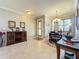 Spacious dining area with hardwood floors and a view of the foyer at 9367 Hawk Nest Ln, North Port, FL 34287