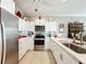 Modern kitchen with stainless steel appliances and white cabinets at 9367 Hawk Nest Ln, North Port, FL 34287