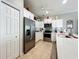 Stainless steel appliances and white cabinets in this kitchen at 9367 Hawk Nest Ln, North Port, FL 34287