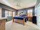 Large main bedroom with wood furniture and bay windows at 9367 Hawk Nest Ln, North Port, FL 34287