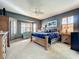 Large main bedroom with wood furniture and bay windows at 9367 Hawk Nest Ln, North Port, FL 34287