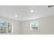 Well-lit bedroom featuring white walls and plantation shutters at 939 Cronley Pl, Sarasota, FL 34237