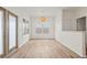 Light-filled dining room with hardwood floors and large windows at 939 Cronley Pl, Sarasota, FL 34237