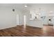 Bright and airy living room with wood-look flooring and ceiling fan at 939 Cronley Pl, Sarasota, FL 34237