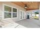 Screened lanai with wood ceiling, french doors and backyard view at 939 Cronley Pl, Sarasota, FL 34237