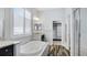 Relaxing bathroom with a soaking tub and walk-in shower at 1115 116Th E St, Bradenton, FL 34212