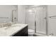 Clean bathroom with granite countertop and a glass shower at 1115 116Th E St, Bradenton, FL 34212