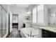 Elegant bathroom featuring a soaking tub and double vanity at 1115 116Th E St, Bradenton, FL 34212