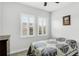 Charming bedroom with a comfortable bed and plantation shutters at 1115 116Th E St, Bradenton, FL 34212