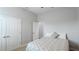 Simple bedroom with double doors and a comfy bed at 1115 116Th E St, Bradenton, FL 34212