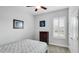 Cozy bedroom with a dresser and plantation shutters at 1115 116Th E St, Bradenton, FL 34212