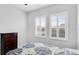 Serene bedroom with two windows and plantation shutters at 1115 116Th E St, Bradenton, FL 34212