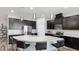 Modern kitchen with large island and stainless steel appliances at 1115 116Th E St, Bradenton, FL 34212