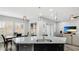 Kitchen with large island, granite countertops and stainless steel appliances at 1115 116Th E St, Bradenton, FL 34212