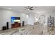 Spacious living room with large TV and hardwood floors at 1115 116Th E St, Bradenton, FL 34212