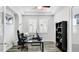 Home office with built-in shelving and hardwood floors at 1115 116Th E St, Bradenton, FL 34212