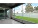 Spacious screened porch with backyard access and view of the lawn at 1115 116Th E St, Bradenton, FL 34212