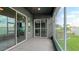 Screened porch with sliding doors leading to the backyard at 1115 116Th E St, Bradenton, FL 34212