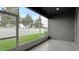 Screened porch overlooking a grassy backyard with privacy fence at 1115 116Th E St, Bradenton, FL 34212