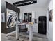 Bright and airy art studio with work table, mini-fridge, and plenty of natural light at 1330 N Lockwood Ridge Rd, Sarasota, FL 34237