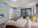 Spacious bedroom with sliding glass doors and contemporary decor at 1330 N Lockwood Ridge Rd, Sarasota, FL 34237