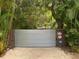 Private gated entry with corrugated metal gate at 1330 N Lockwood Ridge Rd, Sarasota, FL 34237