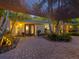 Mid-century modern home with double front doors and well-manicured landscaping at 1330 N Lockwood Ridge Rd, Sarasota, FL 34237