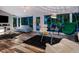 Spacious living room with hardwood floors, large windows, and comfortable seating at 1330 N Lockwood Ridge Rd, Sarasota, FL 34237