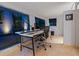 Home office with a large desk, modern chair, and ample natural light at 1330 N Lockwood Ridge Rd, Sarasota, FL 34237