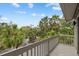 Balcony offering scenic views of a tree-lined street at 1444 Landings Cir # 72, Sarasota, FL 34231