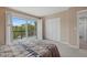 Bright bedroom with sliding glass doors to balcony at 1444 Landings Cir # 72, Sarasota, FL 34231