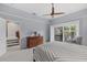 Bedroom with wood platform bed, ceiling fan and access to balcony at 1444 Landings Cir # 72, Sarasota, FL 34231