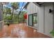 Spacious deck with seating area and screened enclosure at 1444 Landings Cir # 72, Sarasota, FL 34231
