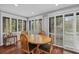 Bright dining room with wood floors and white plantation shutters at 1444 Landings Cir # 72, Sarasota, FL 34231