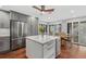 Spacious kitchen island with white quartz countertops and stainless steel appliances at 1444 Landings Cir # 72, Sarasota, FL 34231
