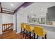Modern kitchen with gray cabinets, white island, and hardwood floors at 1444 Landings Cir # 72, Sarasota, FL 34231