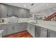 Modern kitchen with gray cabinets, stainless steel appliances, and white quartz countertops at 1444 Landings Cir # 72, Sarasota, FL 34231