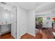 Modern powder room with gray vanity and wood floors at 1444 Landings Cir # 72, Sarasota, FL 34231