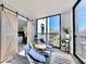 Balcony with scenic views, comfortable seating and access to the main bedroom via sliding barn door at 14820 Rue De Bayonne # 308, Clearwater, FL 33762
