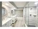 Bright bathroom with updated white vanity and shower/tub combination at 14820 Rue De Bayonne # 308, Clearwater, FL 33762